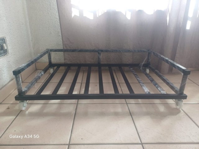 Manufactured portable steel base with wheels